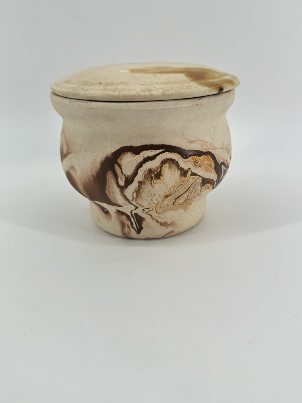Vintage Nemadji Pottery lidded jar featuring a rustic, unglazed cream earth-tone